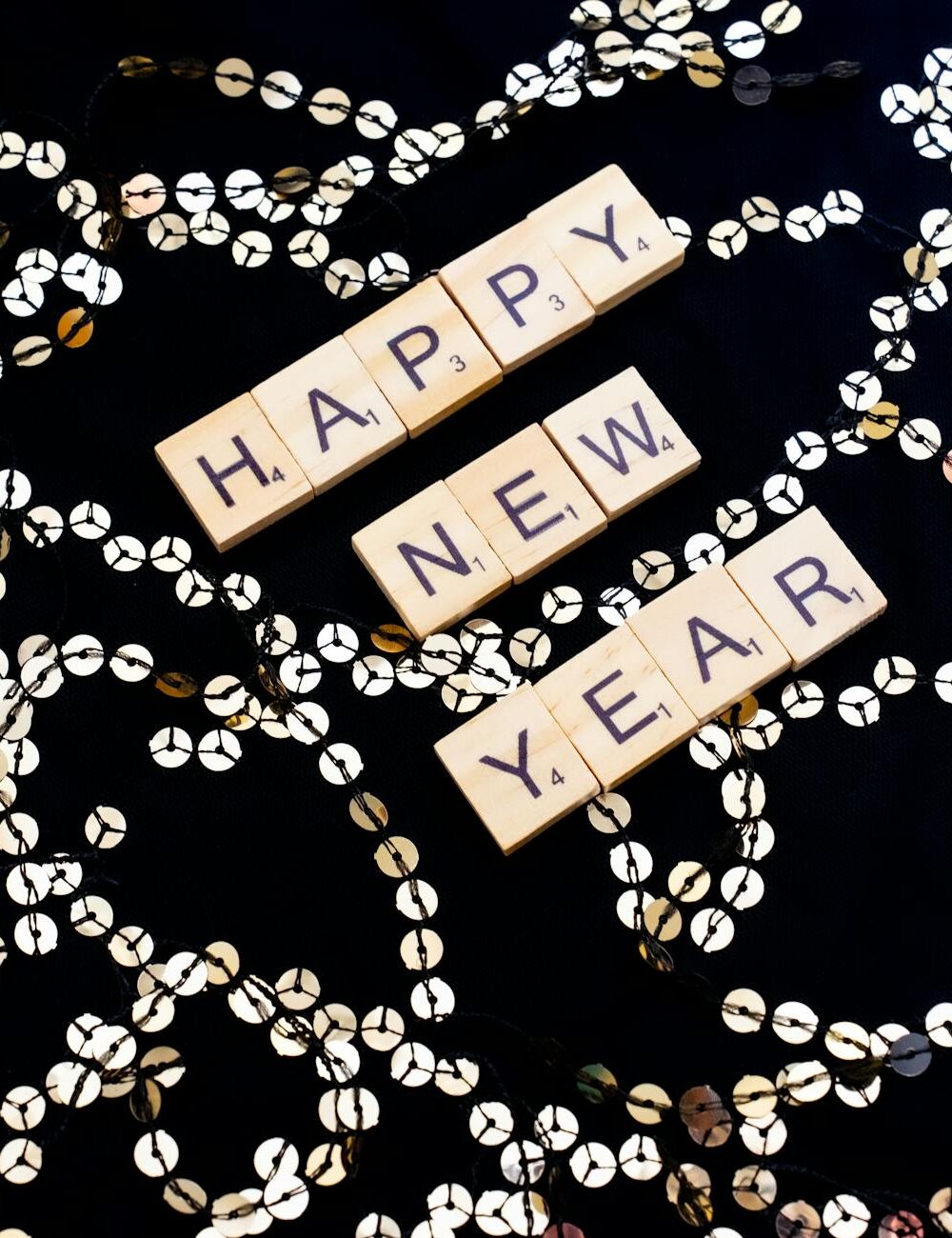 happy new year out of scrabble tiles