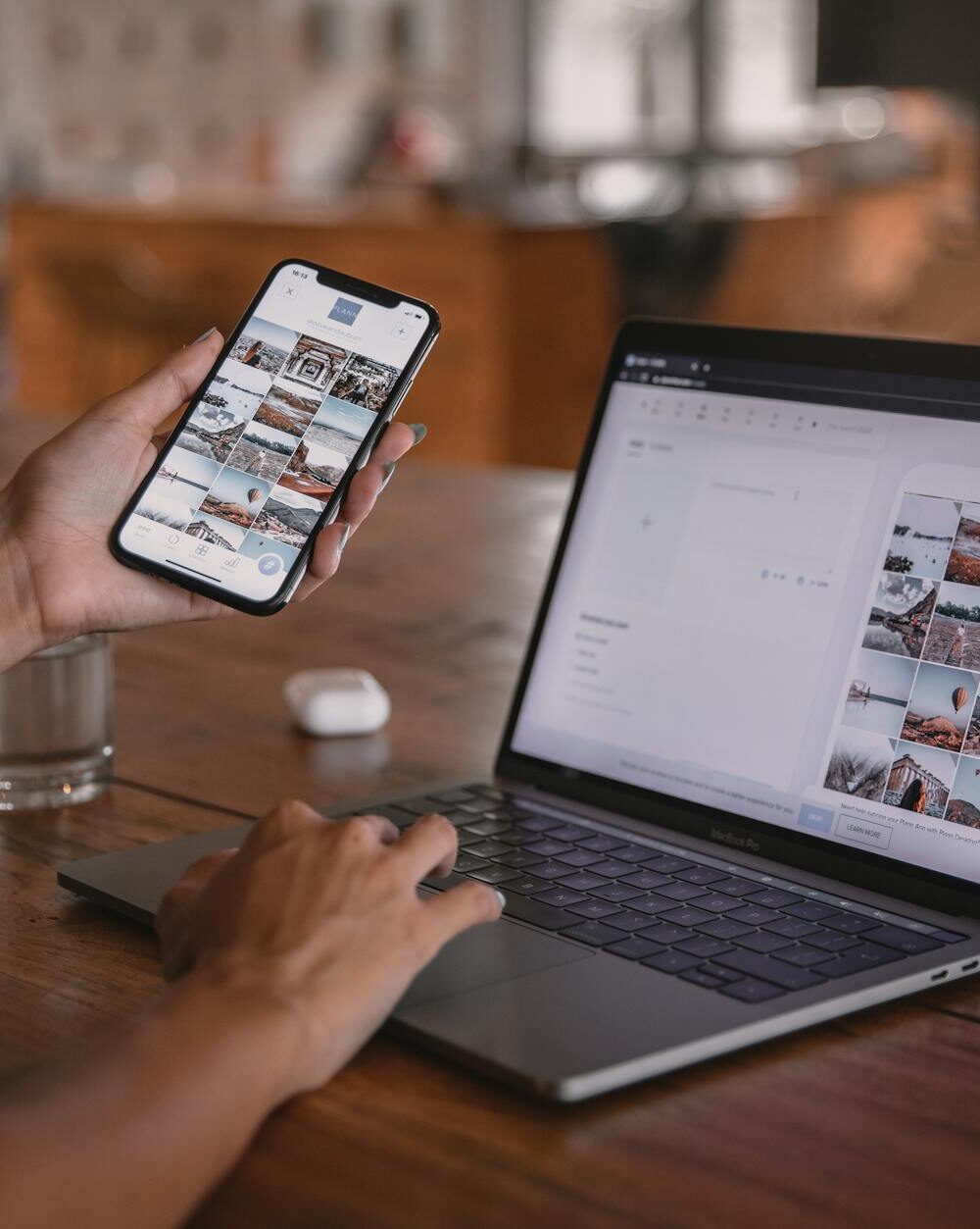 woman using smartphone and laptop