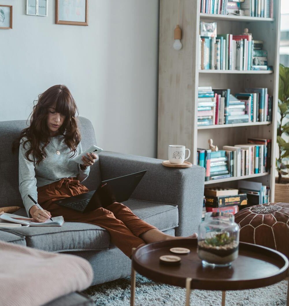 photo of woman sitting on couch