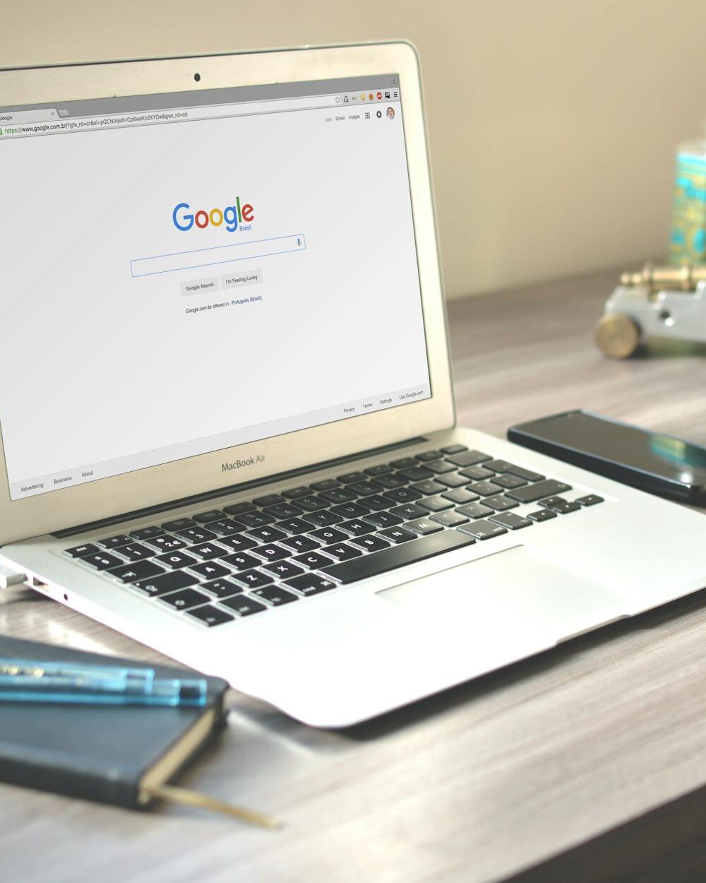 macbook air on grey wooden table