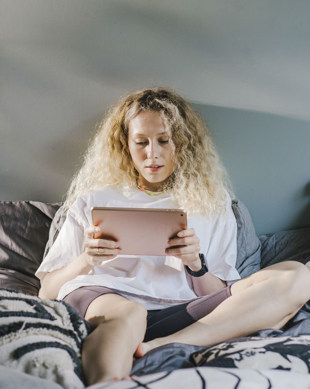 a woman sitting on the bed