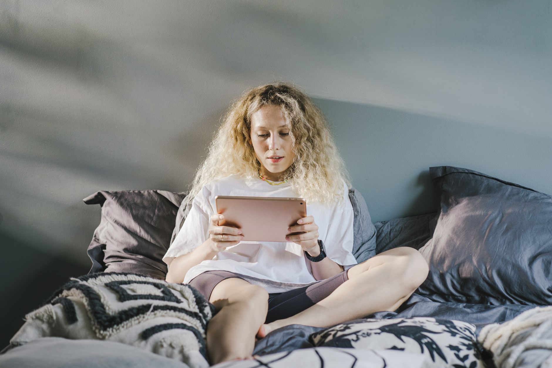 a woman sitting on the bed